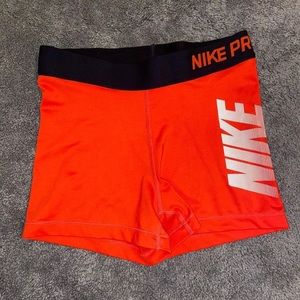 red nike pros
